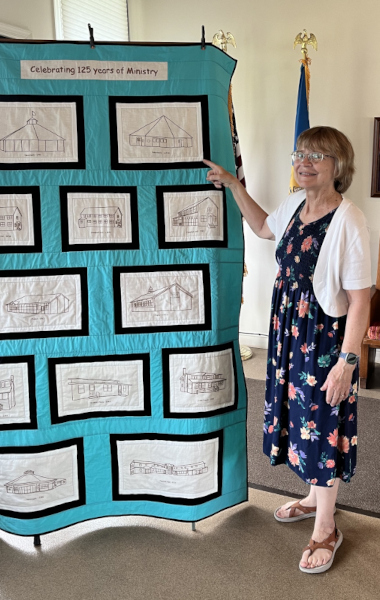 Sara Hindsley (UCC) with the Quilt